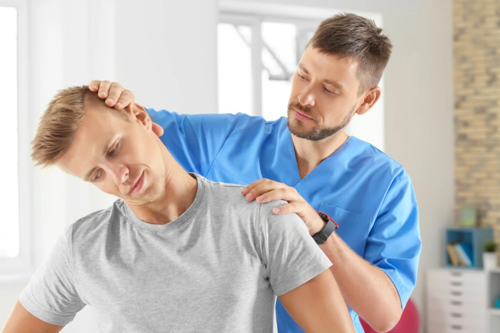 chiropractor practitioner massage male patient